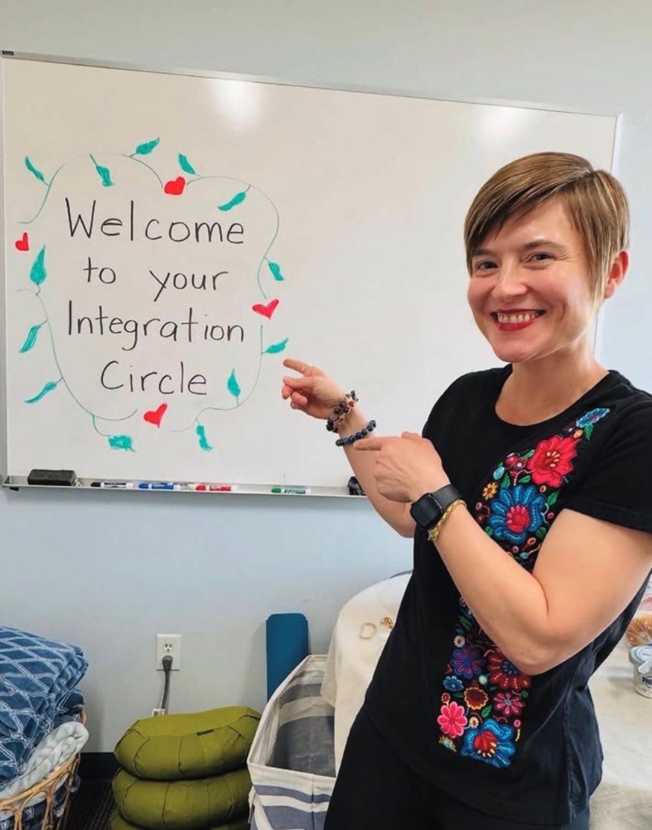 Masha pointing at a whiteboard that reads Welcome to your Integration Circle